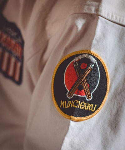Nunchaku Badge of a member of Texas Karate Institute